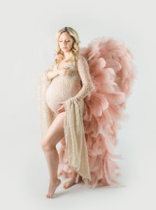 Charlotte mom in large pink wings-NicCole Photography