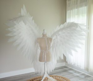 white wings for maternity photoshoot