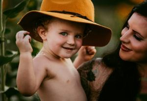 little boy wearing yellow hat