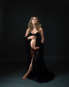 expecting mother in black maternity gown