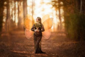 Charlotte expecting mom with fairy wings_niccole photography
