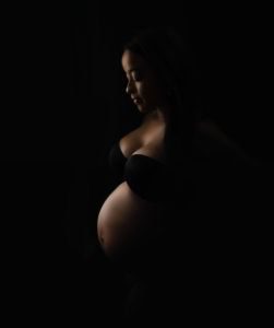 expecting mom dark outline of her baby bump_charlotte maternity photographer