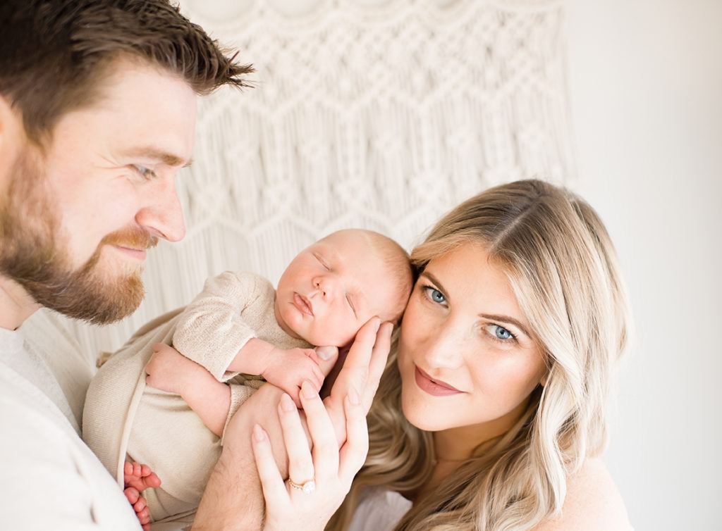 Bright and airy styled photo of Charlotte parents and newborn baby boy