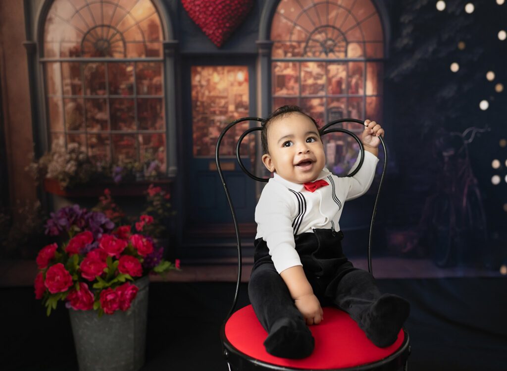 Baby smiling at the camera for Valentine photoshoot